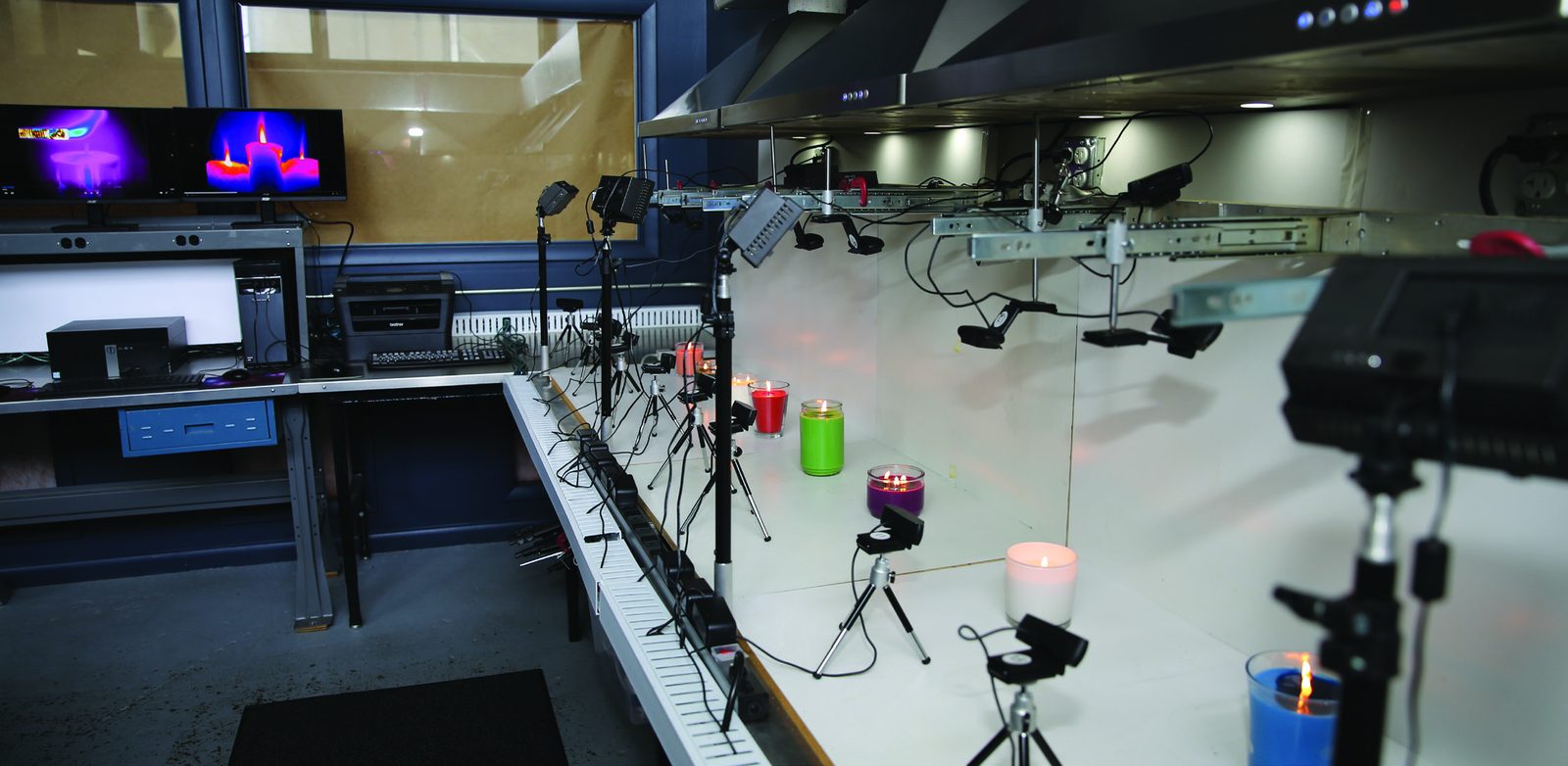 Candle combustion testing in progress in a burn-test lab.